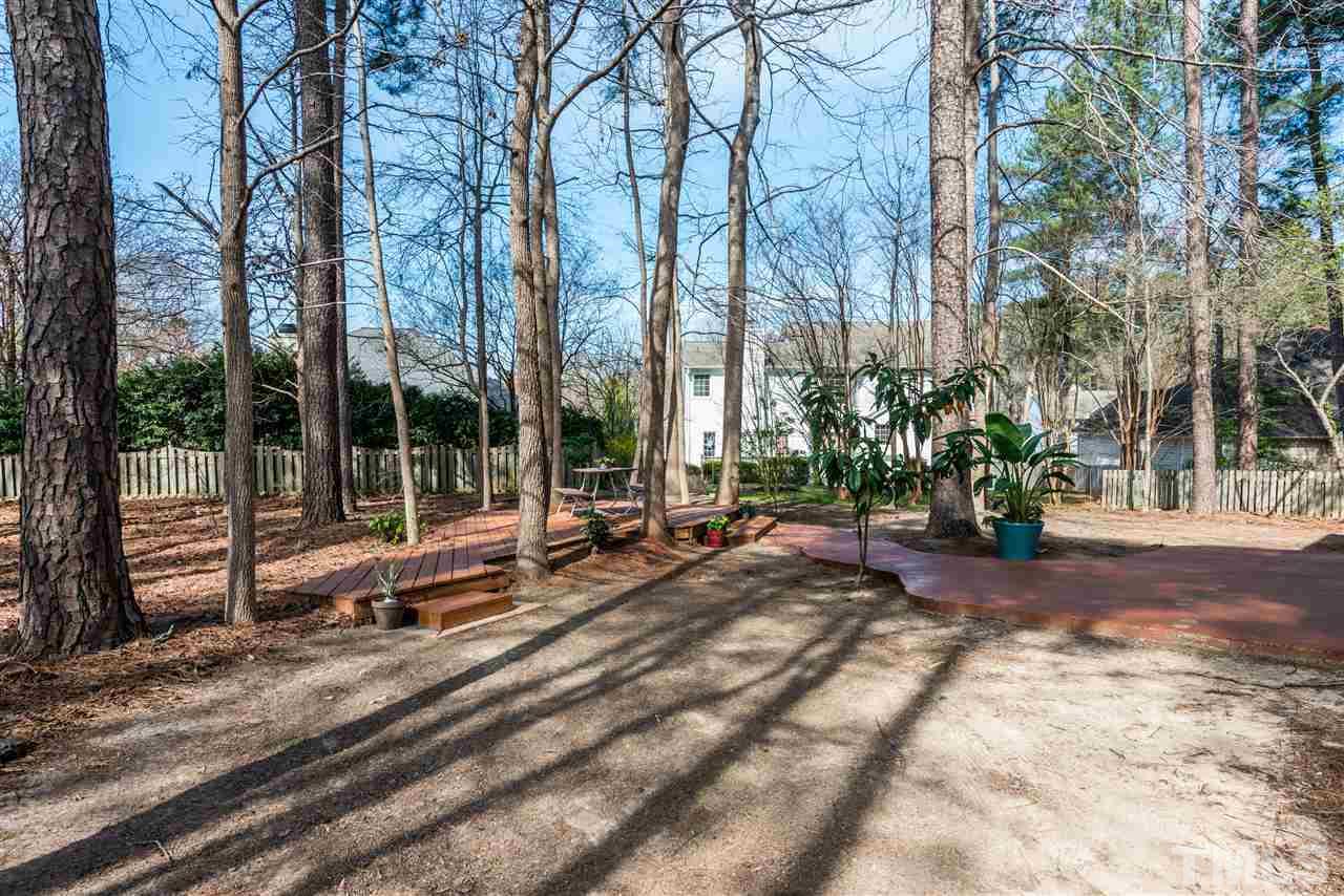 5504 Edgebury Road Raleigh, NC 27613 - Photo 22 of 25 a view of a park with large trees