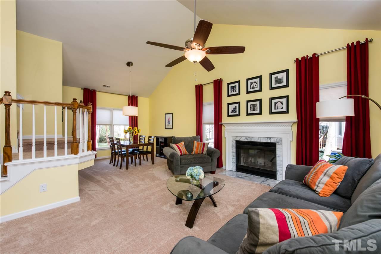 5504 Edgebury Road Raleigh, NC 27613 - Photo 5 of 25 a living room with furniture or couch and a fireplace