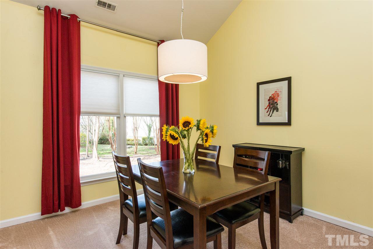 5504 Edgebury Road Raleigh, NC 27613 - Photo 6 of 25 a view of a dining room with furniture and a window