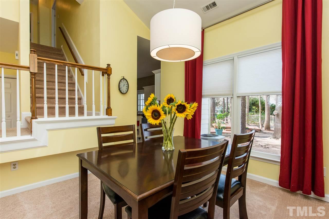 5504 Edgebury Road Raleigh, NC 27613 - Photo 7 of 25 a view of a dining room with furniture and a window