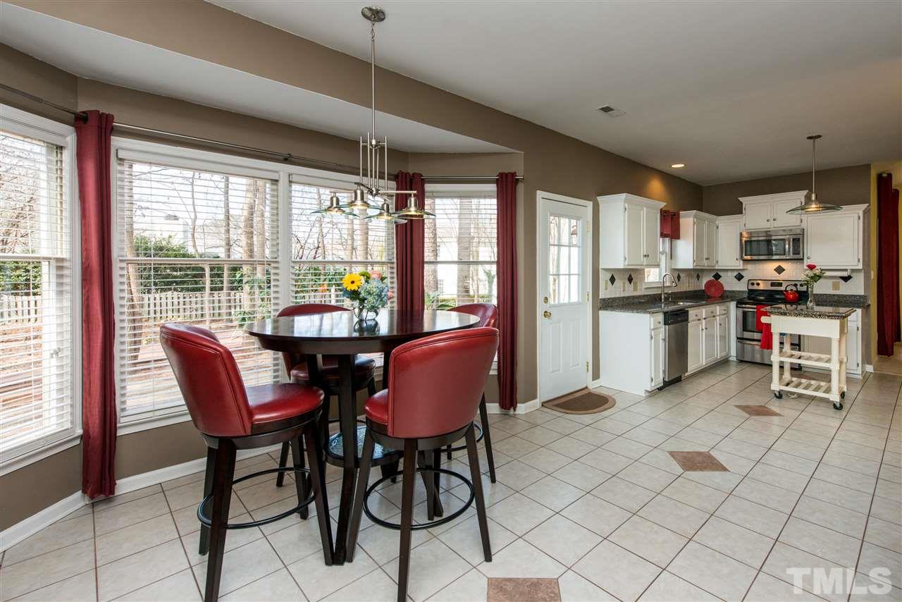 5504 Edgebury Road Raleigh, NC 27613 - Photo 8 of 25 a view of a dining room with furniture window and outside view