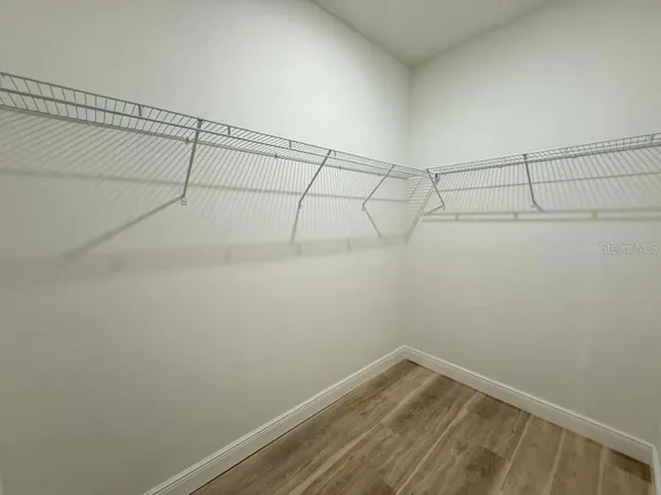 a view of a room with racks on the wall