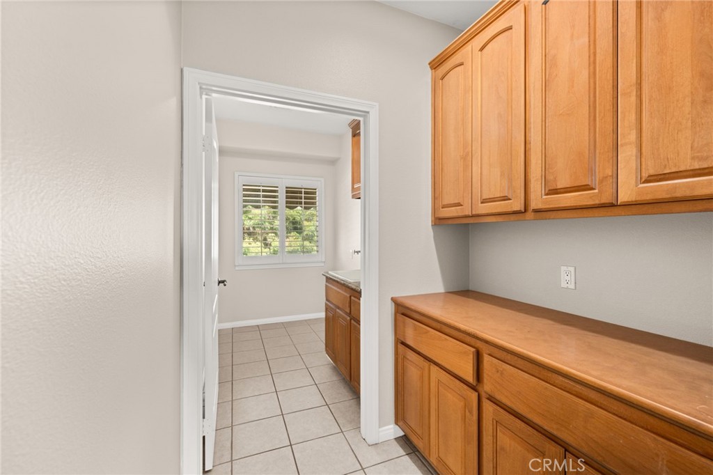 15868 Shorb Street Riverside, CA 92508 - Photo 13 of 15 a view of a kitchen with white cabinets