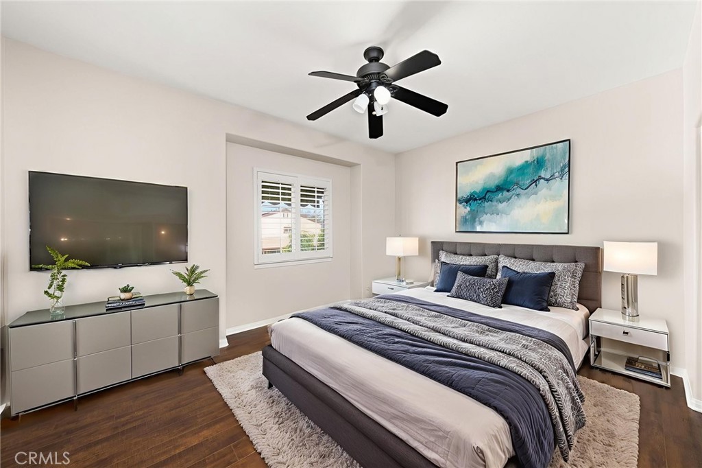 15868 Shorb Street Riverside, CA 92508 - Photo 7 of 15 a bedroom with a large bed and a flat screen tv