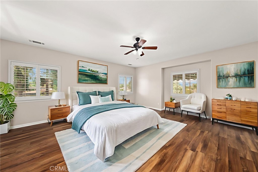 15868 Shorb Street Riverside, CA 92508 - Photo 10 of 15 a bedroom with a bed and wooden floor