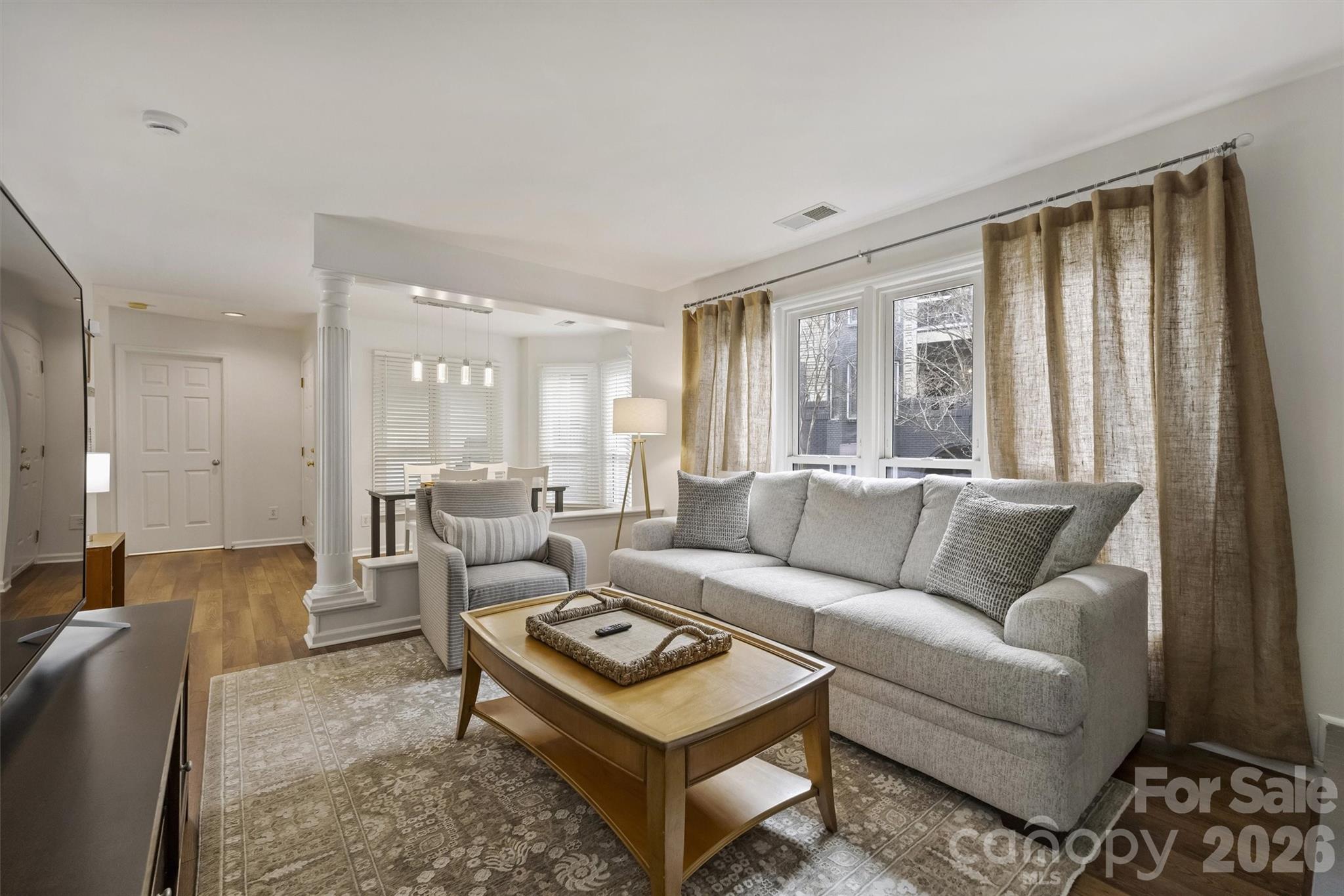 607 Queens Road Charlotte, NC 28207 - Photo 16 of 26 a living room with furniture and a large window