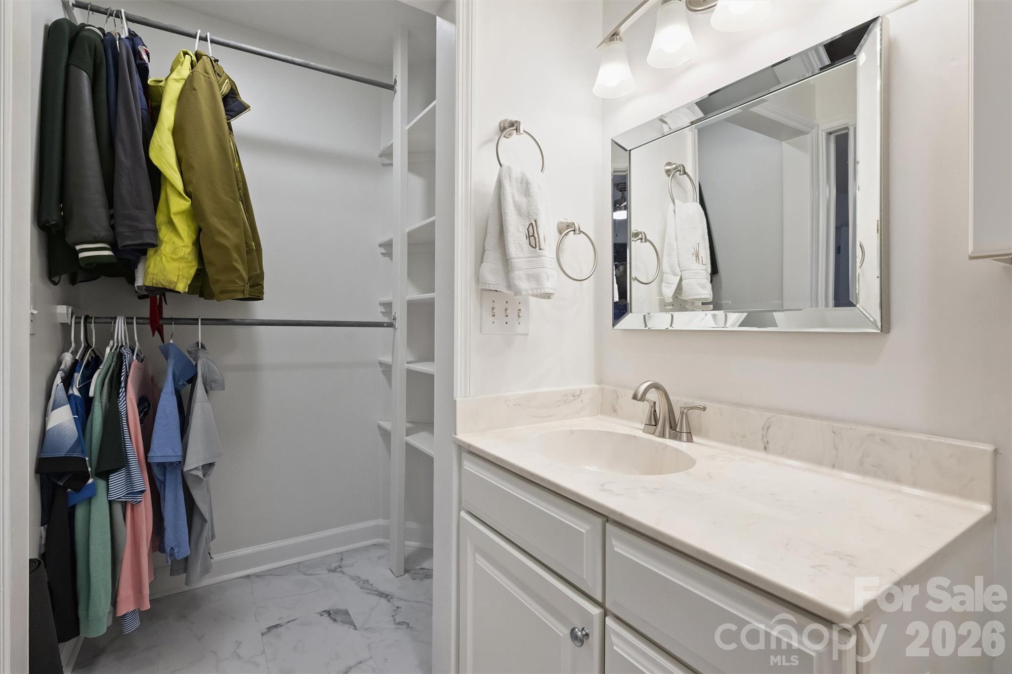 607 Queens Road Charlotte, NC 28207 - Photo 24 of 26 a bathroom with a sink and a mirror