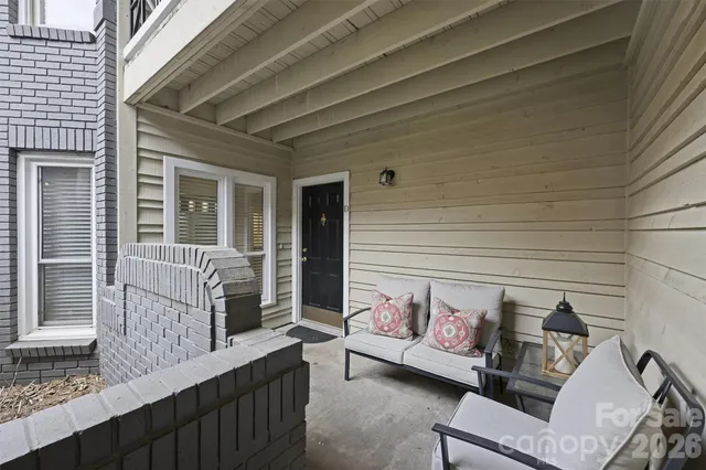 a view of a deck with couches and wooden floor