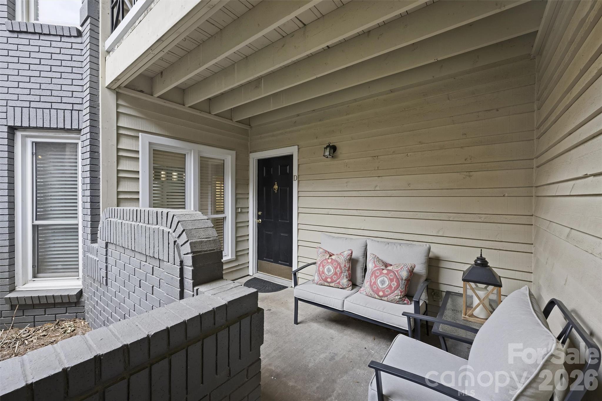 607 Queens Road Charlotte, NC 28207 - Photo 3 of 26 a view of a deck with couches and wooden floor