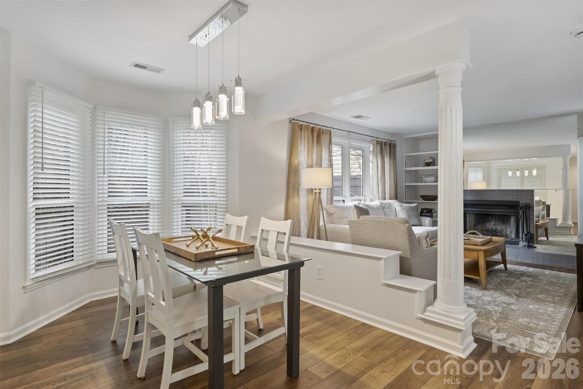 607 Queens Road Charlotte, NC 28207 - Photo 7 of 26 a living room with fireplace furniture and a large window