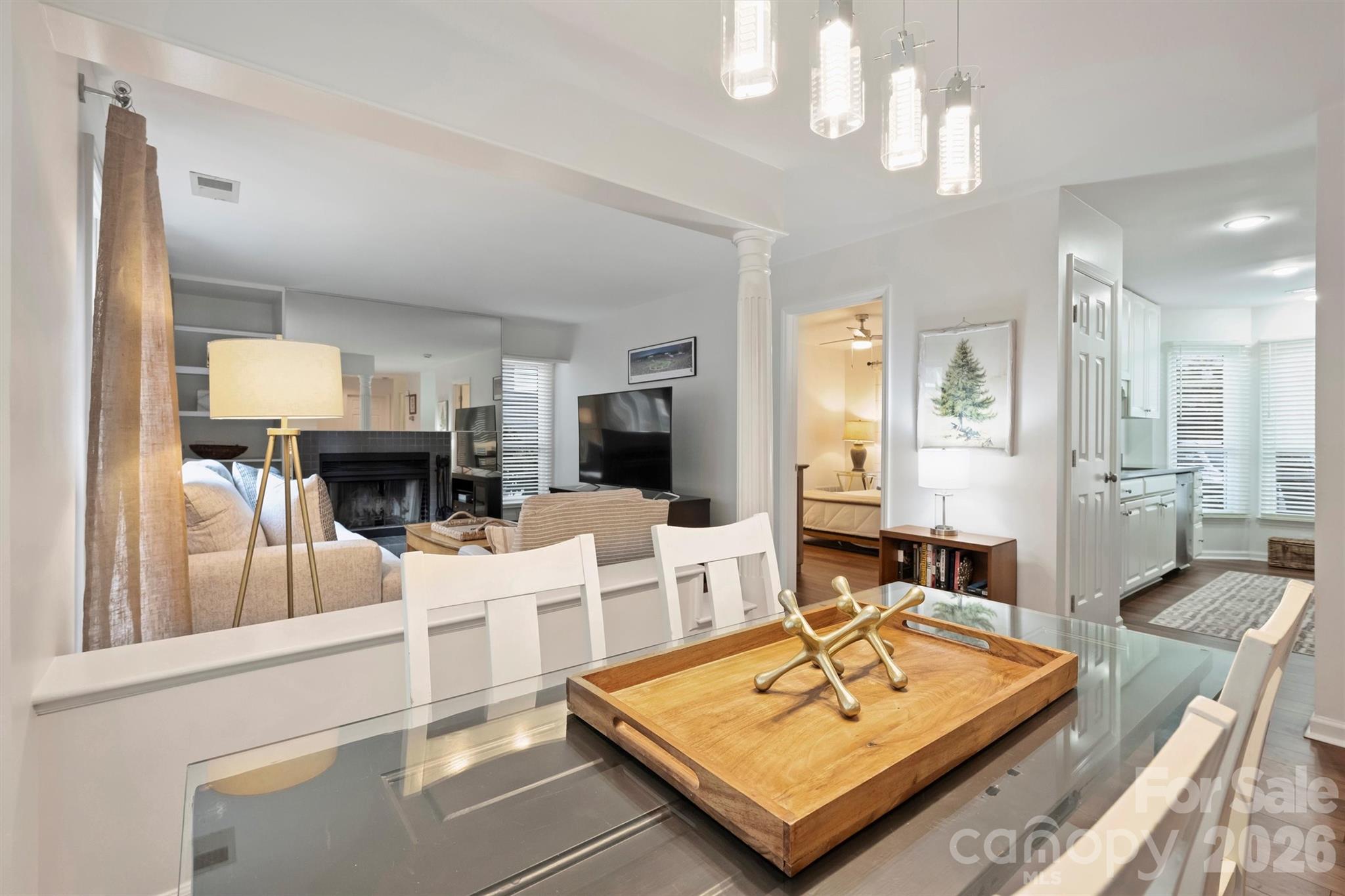 607 Queens Road Charlotte, NC 28207 - Photo 8 of 26 a living room with furniture a fireplace and a chandelier