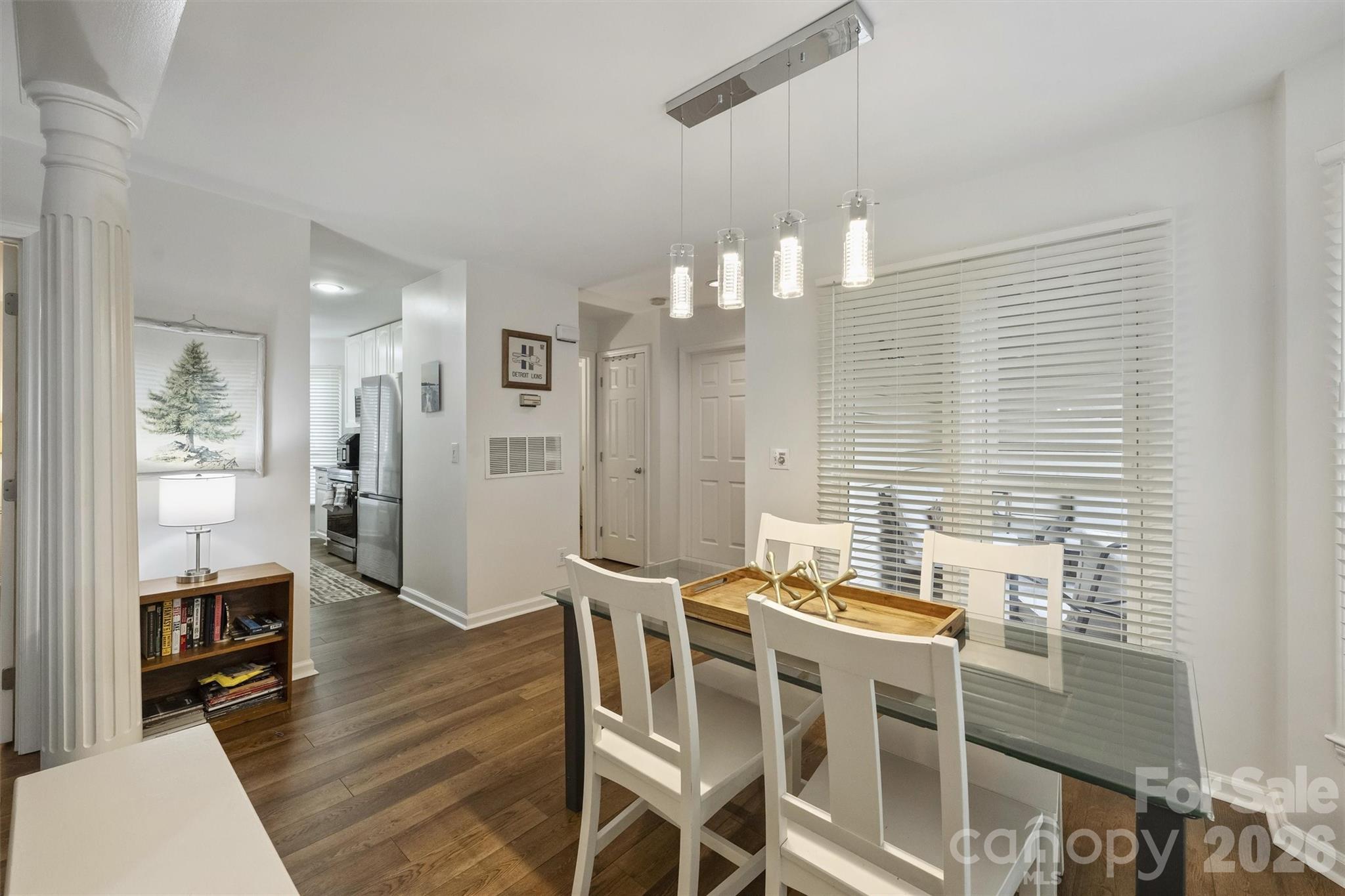 607 Queens Road Charlotte, NC 28207 - Photo 9 of 26 a view of a dining room with furniture and wooden floor