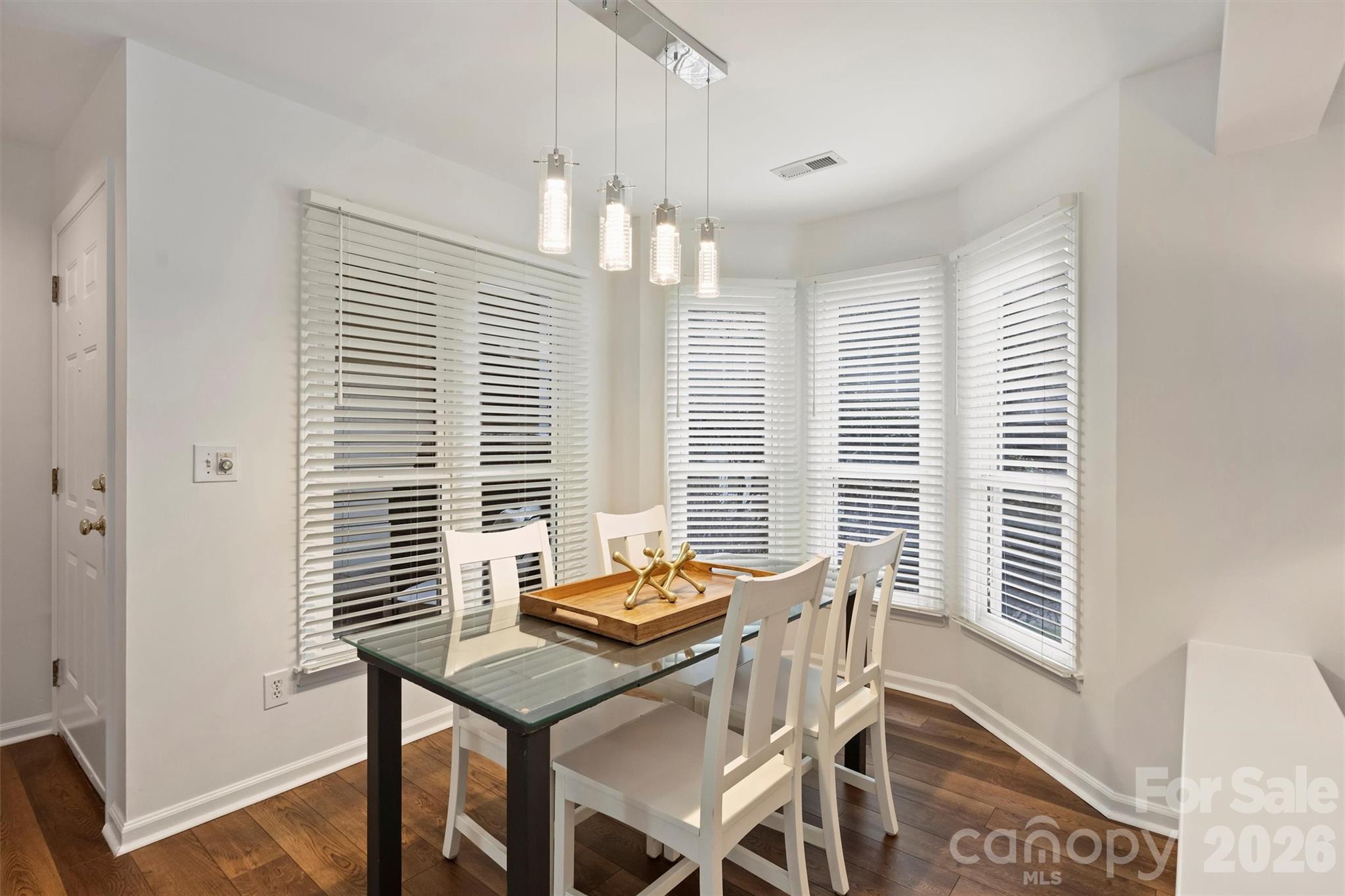 607 Queens Road Charlotte, NC 28207 - Photo 10 of 26 a view of a dining room with furniture and windows