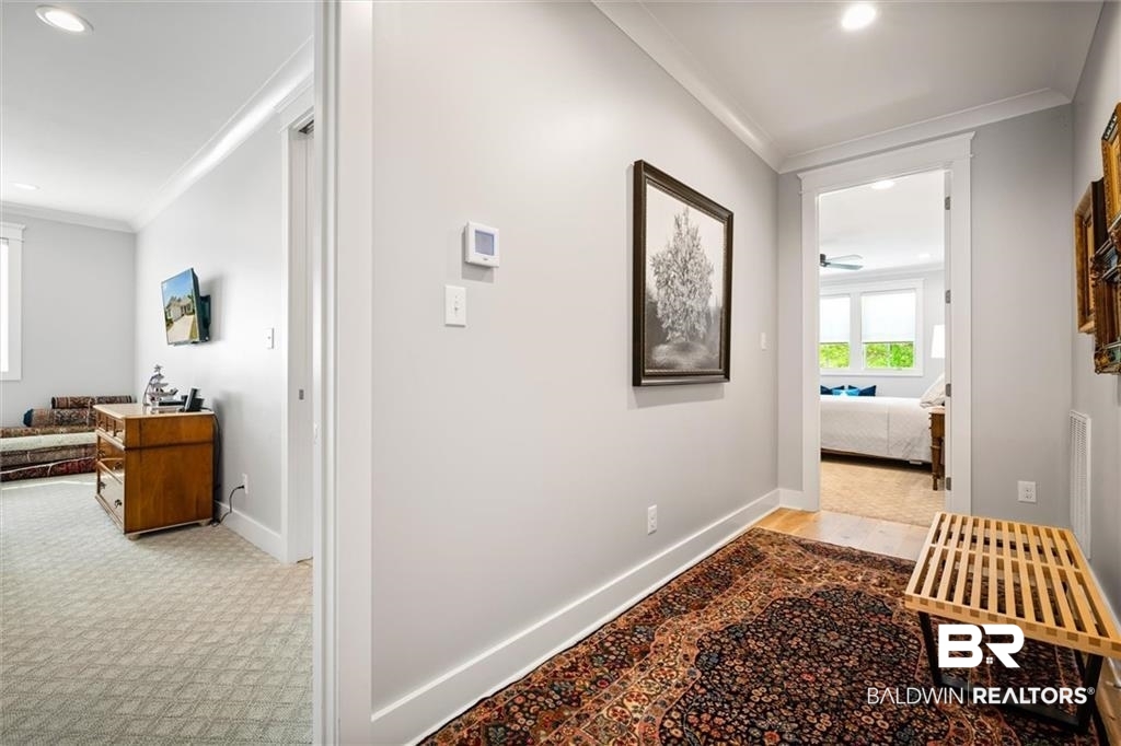 707 Cardamel Court Fairhope, AL 36532 - Photo 27 of 40 Hall with ornamental molding and light colored carpet