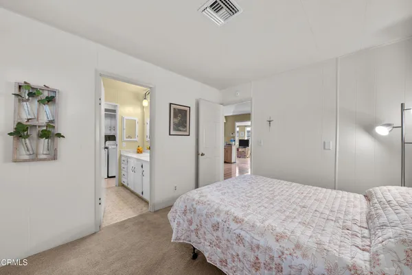 a bedroom with a bed and a table
