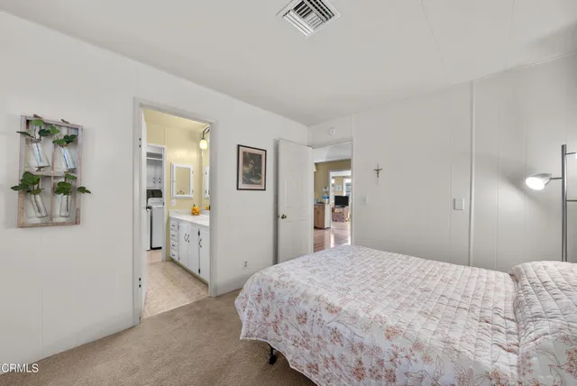 a bedroom with a bed and a table