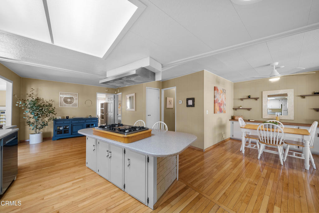 500 West Santa Maria Street, Unit 124 Santa Paula, CA 93060 - Photo 22 of 40 a kitchen with stainless steel appliances granite countertop a stove and cabinets with wooden floor