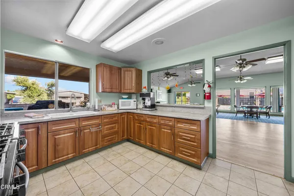a kitchen with stainless steel appliances granite countertop a sink and cabinets