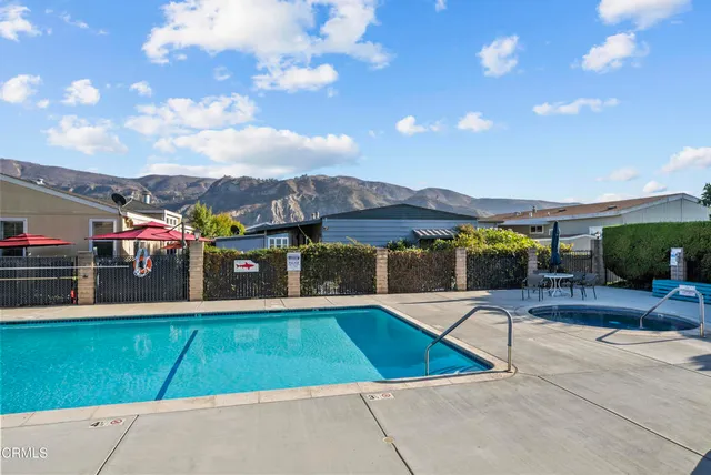 a view of a swimming pool with a lounge chairs