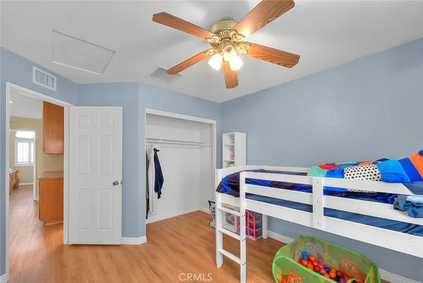 a view of a room with toys and wooden floor
