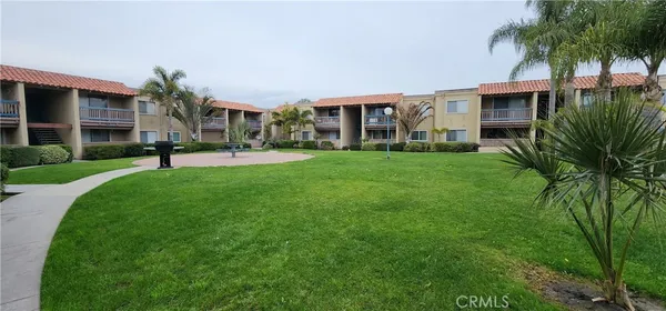 a view of a house with a swimming pool and a garden
