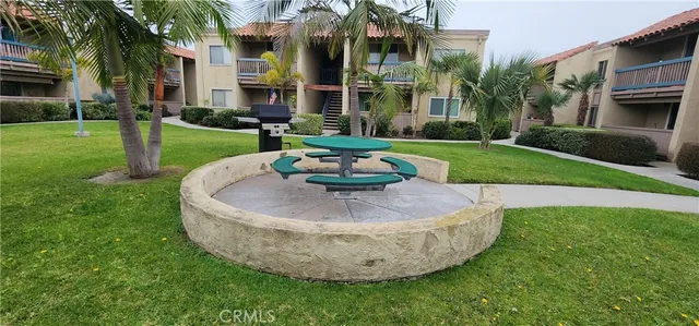 a swimming pool with outdoor seating and yard