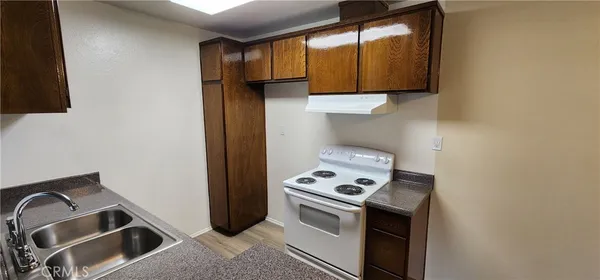 a kitchen with a stove and a microwave