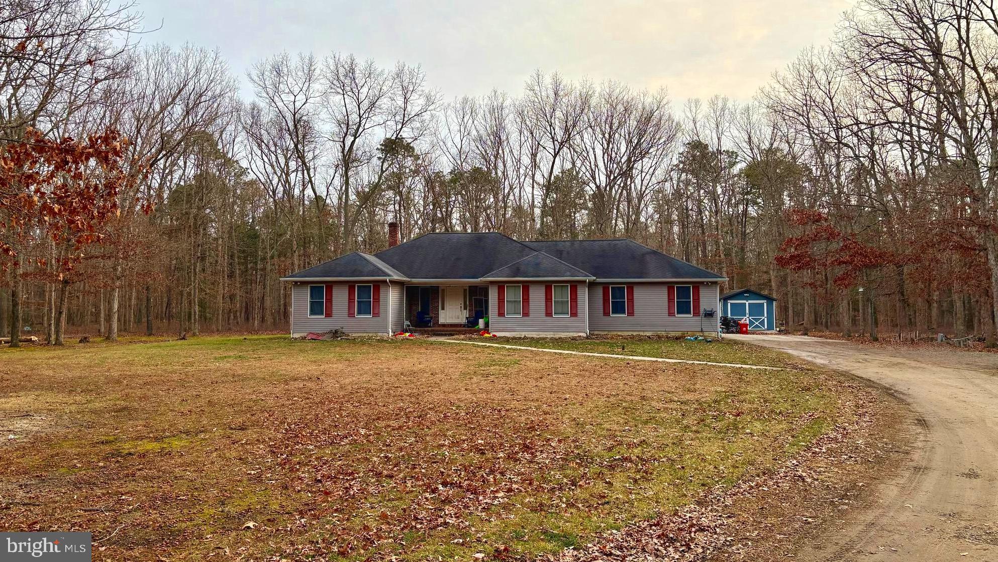 48 Sandy Lane Millville, NJ 08332 - Photo 2 of 6 a front view of a house with a yard