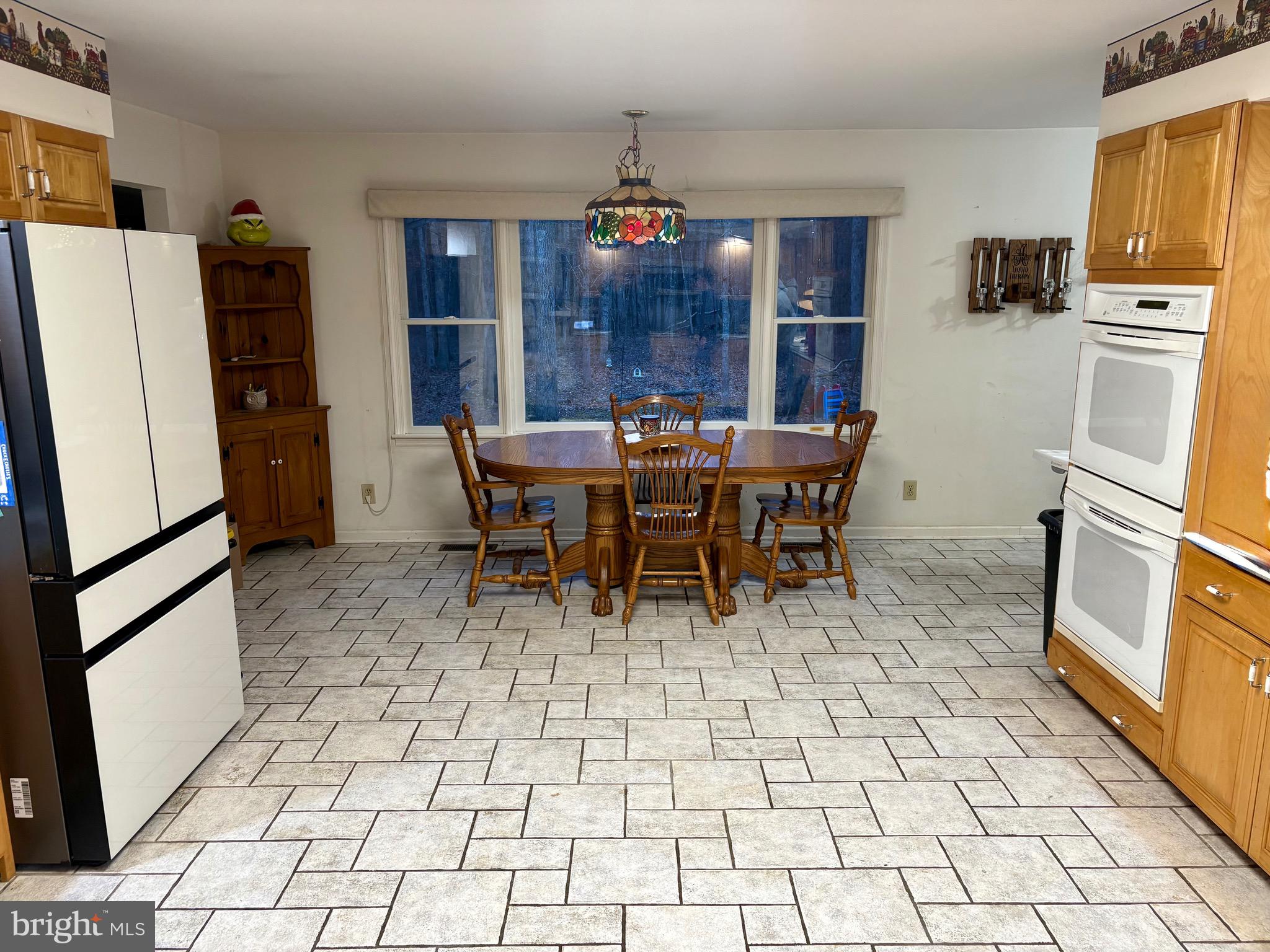 48 Sandy Lane Millville, NJ 08332 - Photo 4 of 6 a view of dining room and kitchen with furniture wooden floor and window