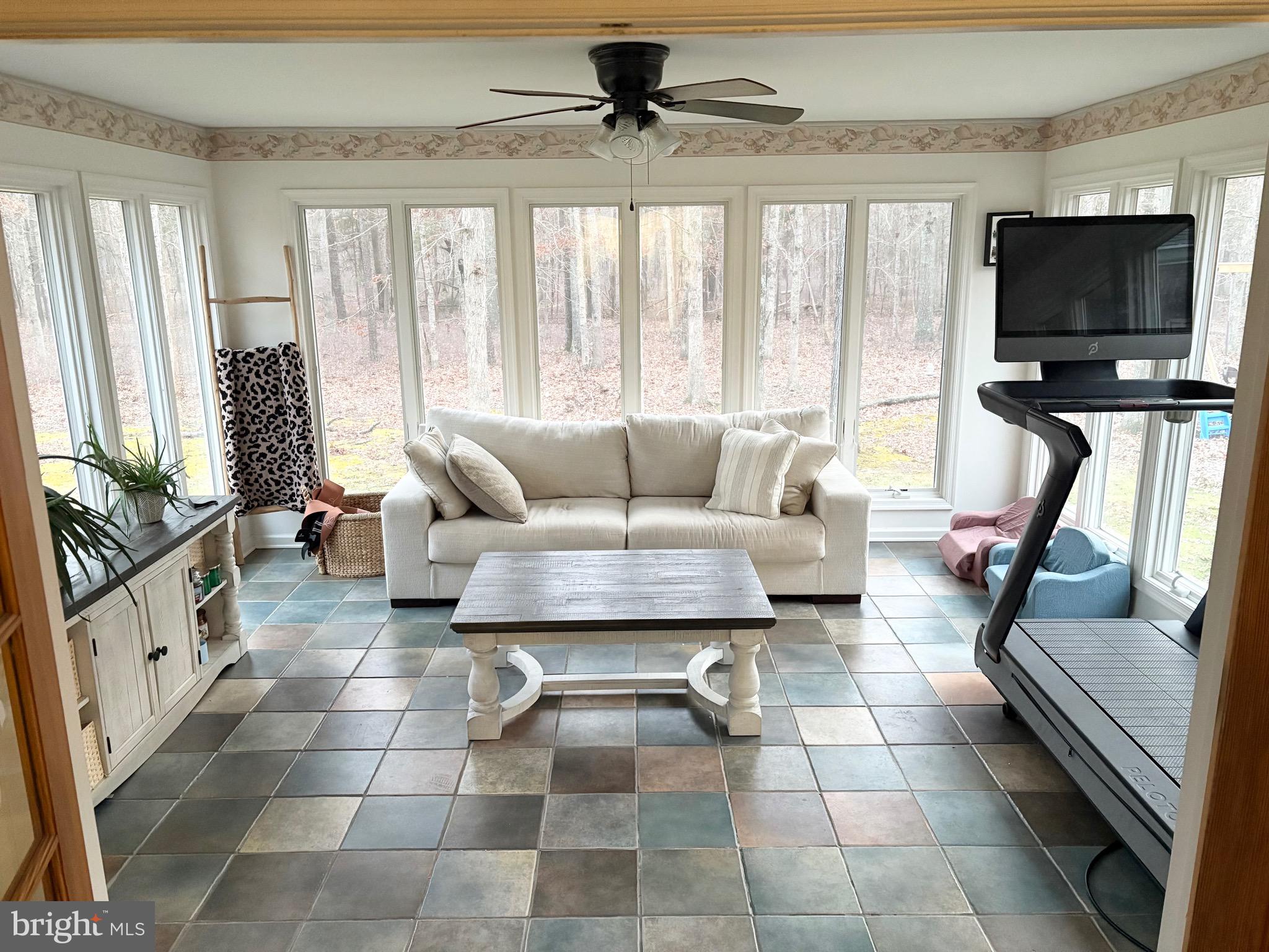 48 Sandy Lane Millville, NJ 08332 - Photo 5 of 6 a living room with furniture and a flat screen tv