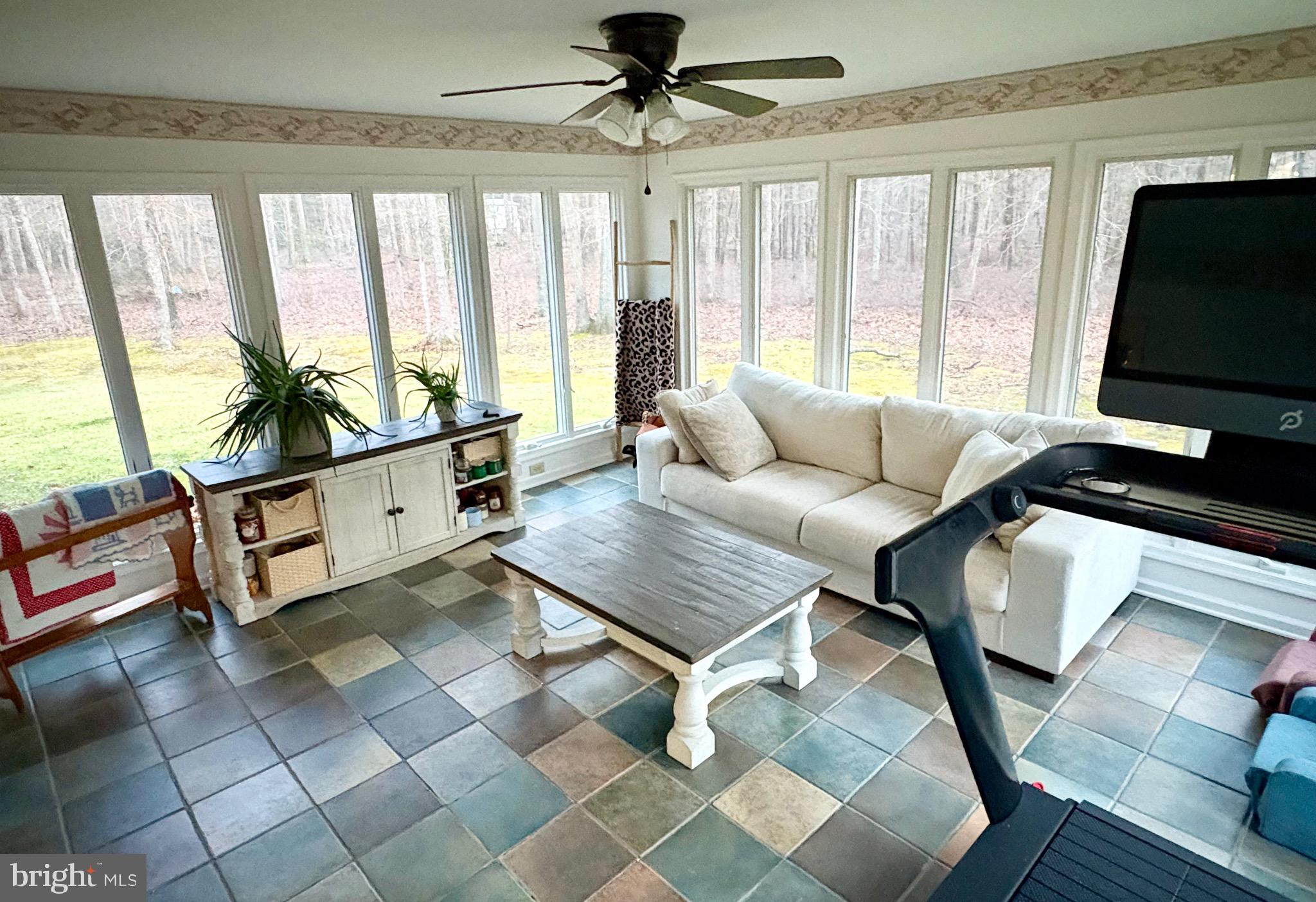 48 Sandy Lane Millville, NJ 08332 - Photo 6 of 6 a living room with furniture and a flat screen tv