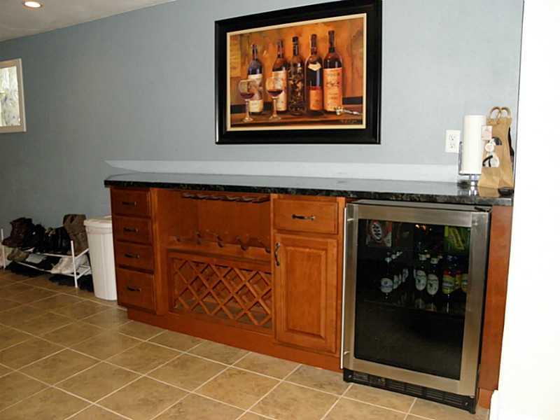 5742 Phillips Road Gibsonia, PA 15044 - Photo 17 of 23 Basement/Game Room. Built-in bar with beverage refrigerator