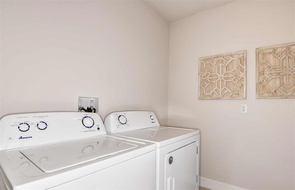 12816 Blue Reflection Avenue Parrish, FL 34219 - Photo 11 of 12 a utility room with dryer and washer
