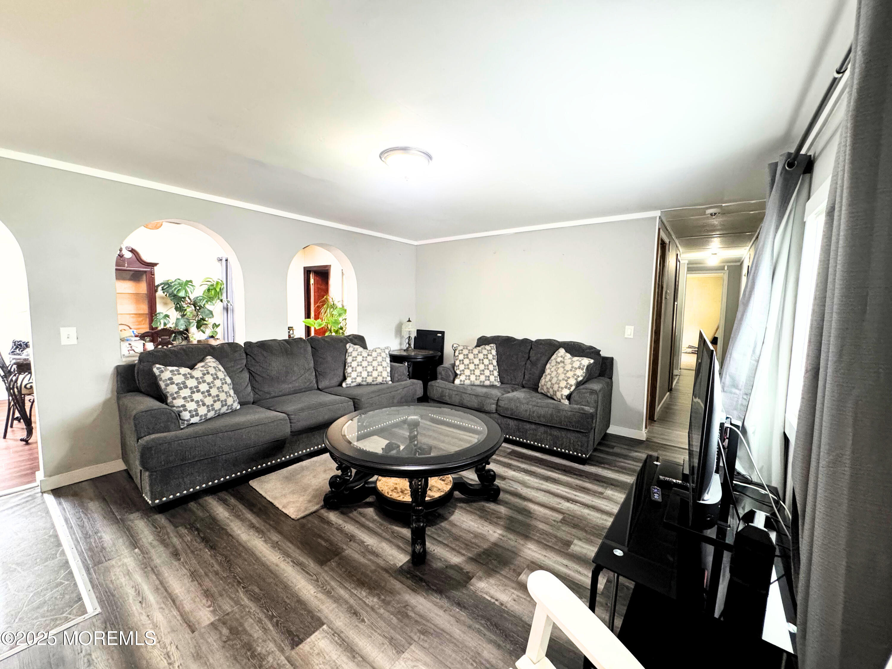 18 Alexander Avenue Jackson, NJ 08527 - Photo 11 of 24 a living room with furniture and a fireplace