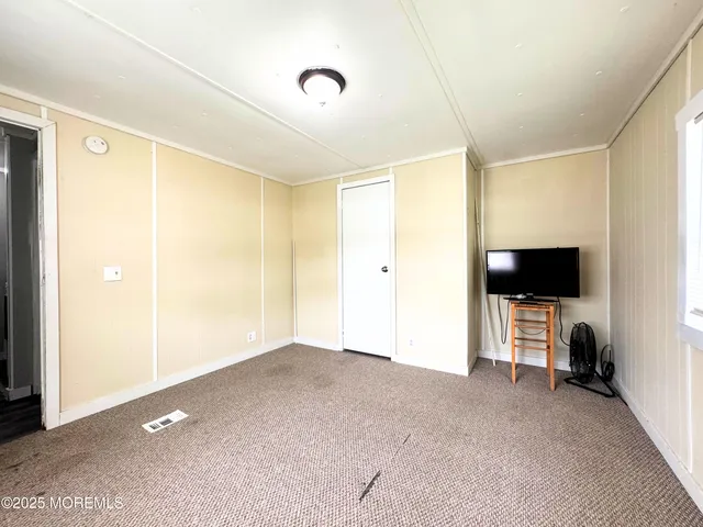 a living room with flat screen tv