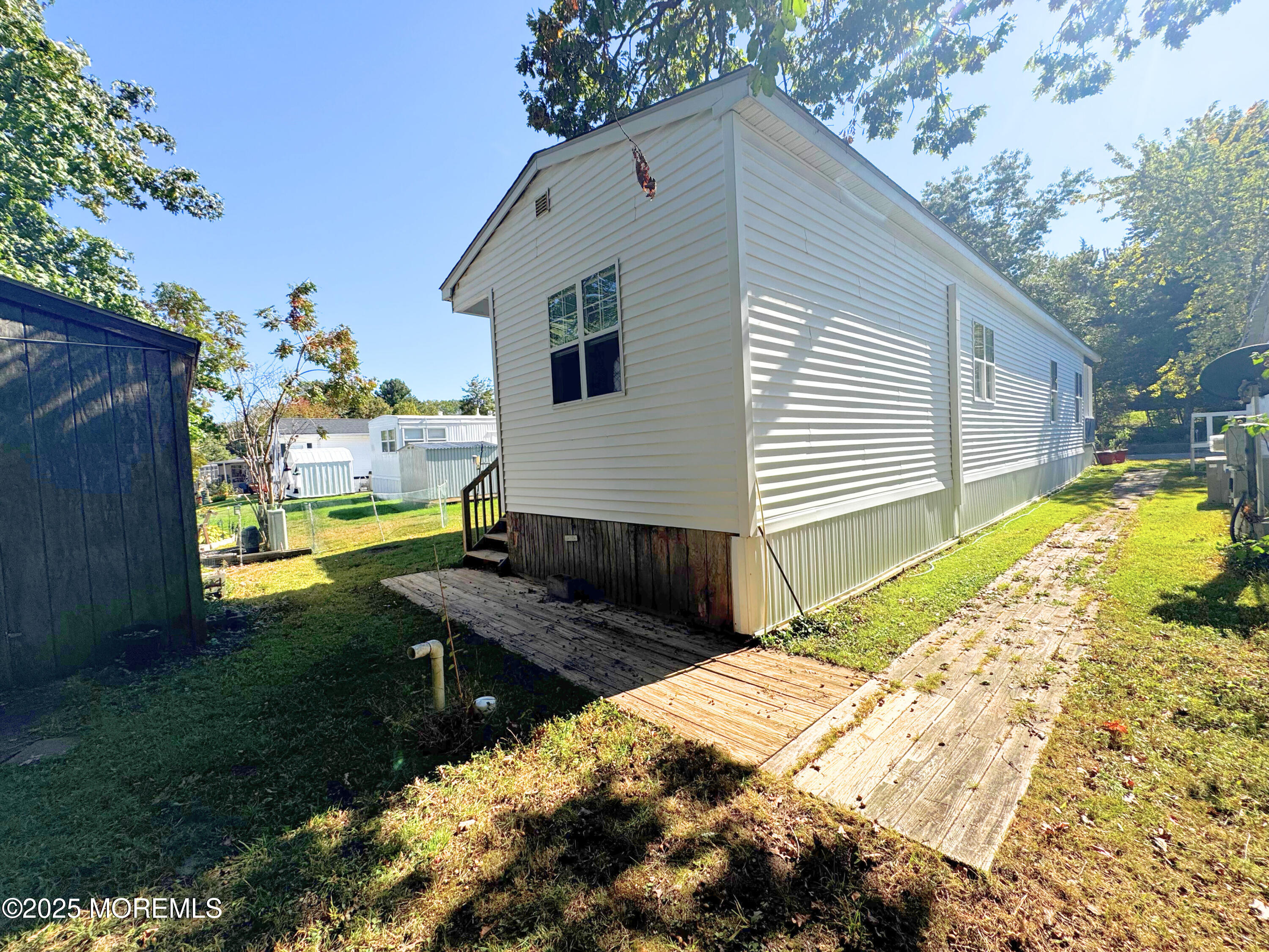 18 Alexander Avenue Jackson, NJ 08527 - Photo 21 of 24 a view of a house with backyard and sitting area