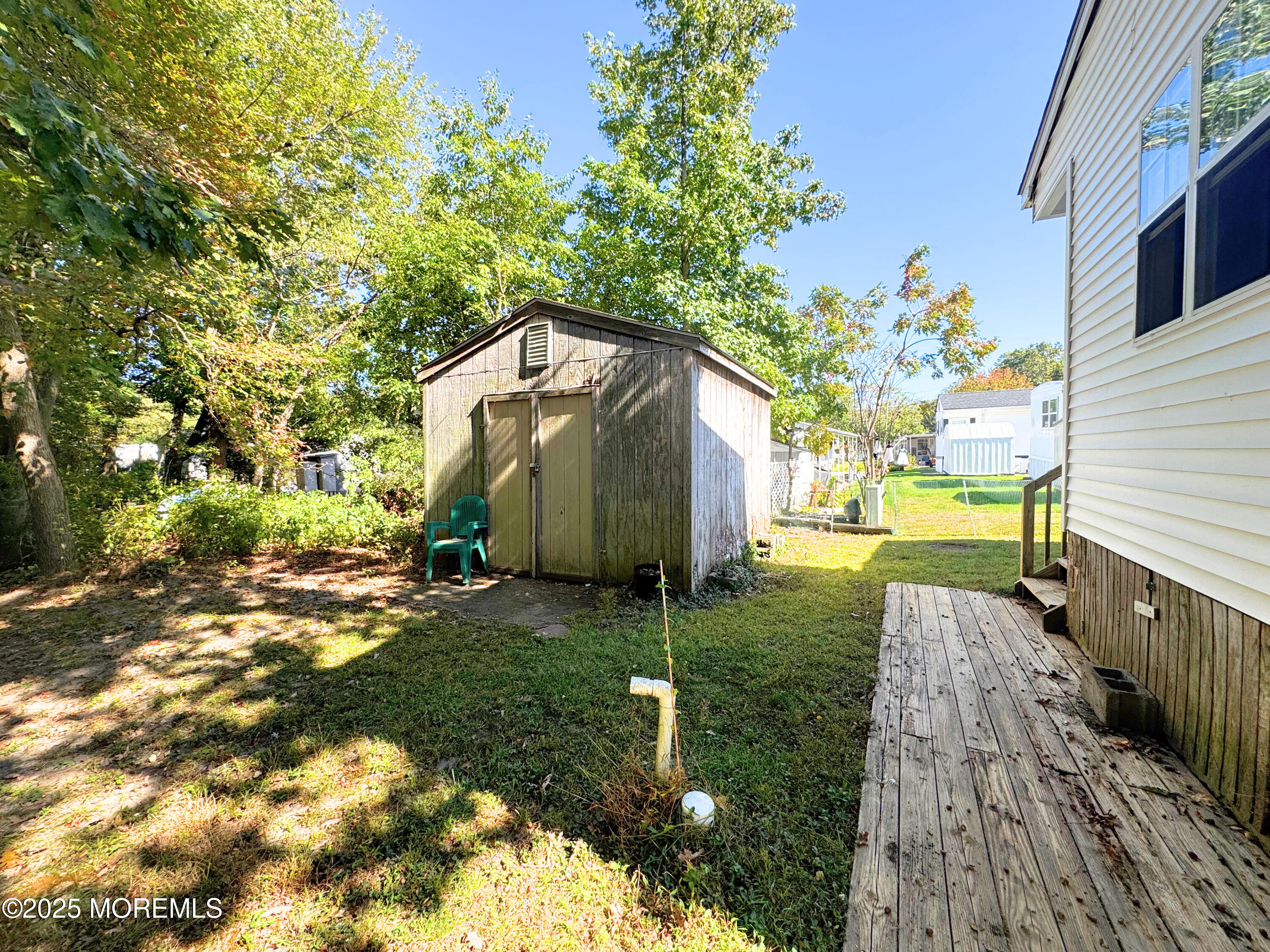 18 Alexander Avenue Jackson, NJ 08527 - Photo 22 of 24 a backyard of a house with lots of green space