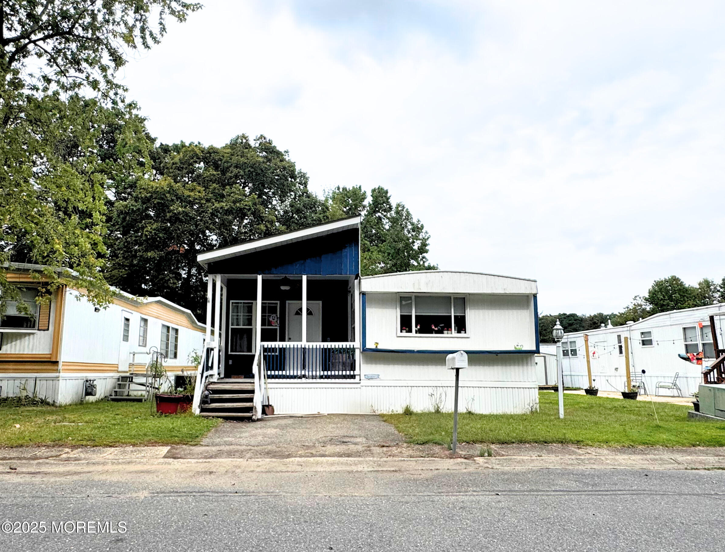 18 Alexander Avenue Jackson, NJ 08527 - Photo 3 of 24 a white house that has a tree in front of it