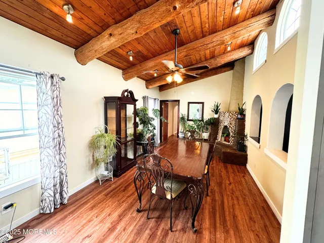 a view of a dining room with furniture window and wooden floor