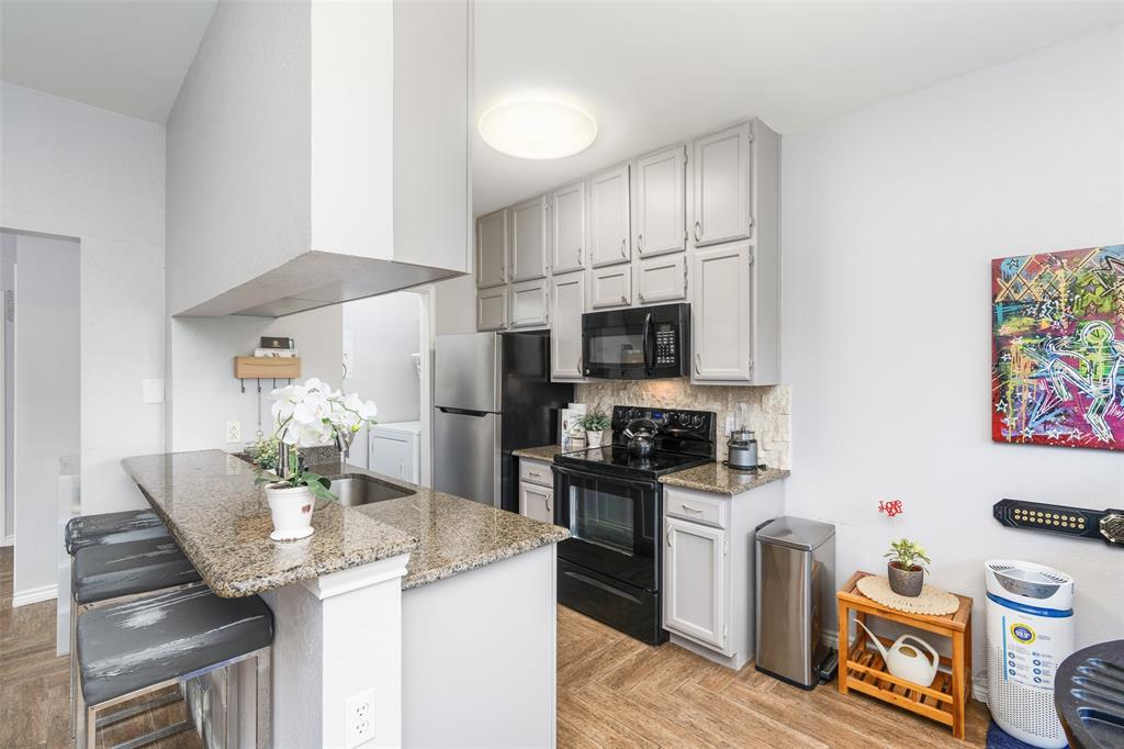 7340 Skillman Street, Unit 1113 Dallas, TX 75231 - Photo 10 of 31 Granite C-Tops & Breakfast Bar Updated SS Appliances & White Cabinetry!
