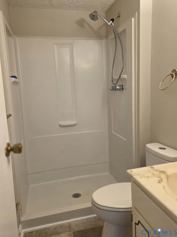 2702 Seminary Avenue Richmond, VA 23220 - Photo 12 of 29 Bathroom with vanity, a shower stall, dark tile pa