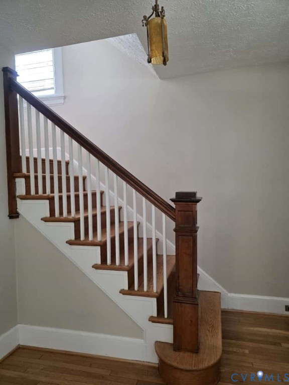 2702 Seminary Avenue Richmond, VA 23220 - Photo 16 of 29 Stairway featuring wood finished floors and a text