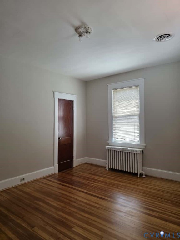 2702 Seminary Avenue Richmond, VA 23220 - Photo 22 of 29 Empty room featuring radiator heating unit and dar