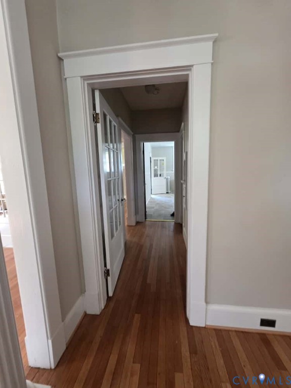 2702 Seminary Avenue Richmond, VA 23220 - Photo 6 of 29 Hall with baseboards and dark wood-style flooring