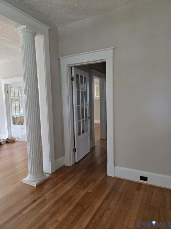 2702 Seminary Avenue Richmond, VA 23220 - Photo 7 of 29 Hallway featuring decorative columns, a textured c