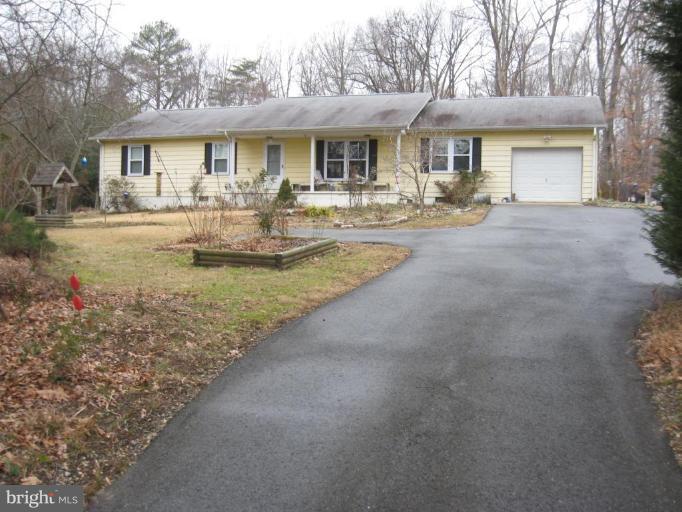 2435 Hallowing Point Road Prince Frederick, MD 20678 - Photo 1 of 3 a front view of a house with yard patio and livingroom view