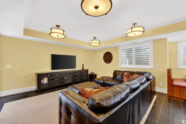714 Draper Heights Way Draper, UT 84020 - Photo 63 of 88 Living area featuring a raised ceiling, wood tiled floors, and healthy amount of natural light