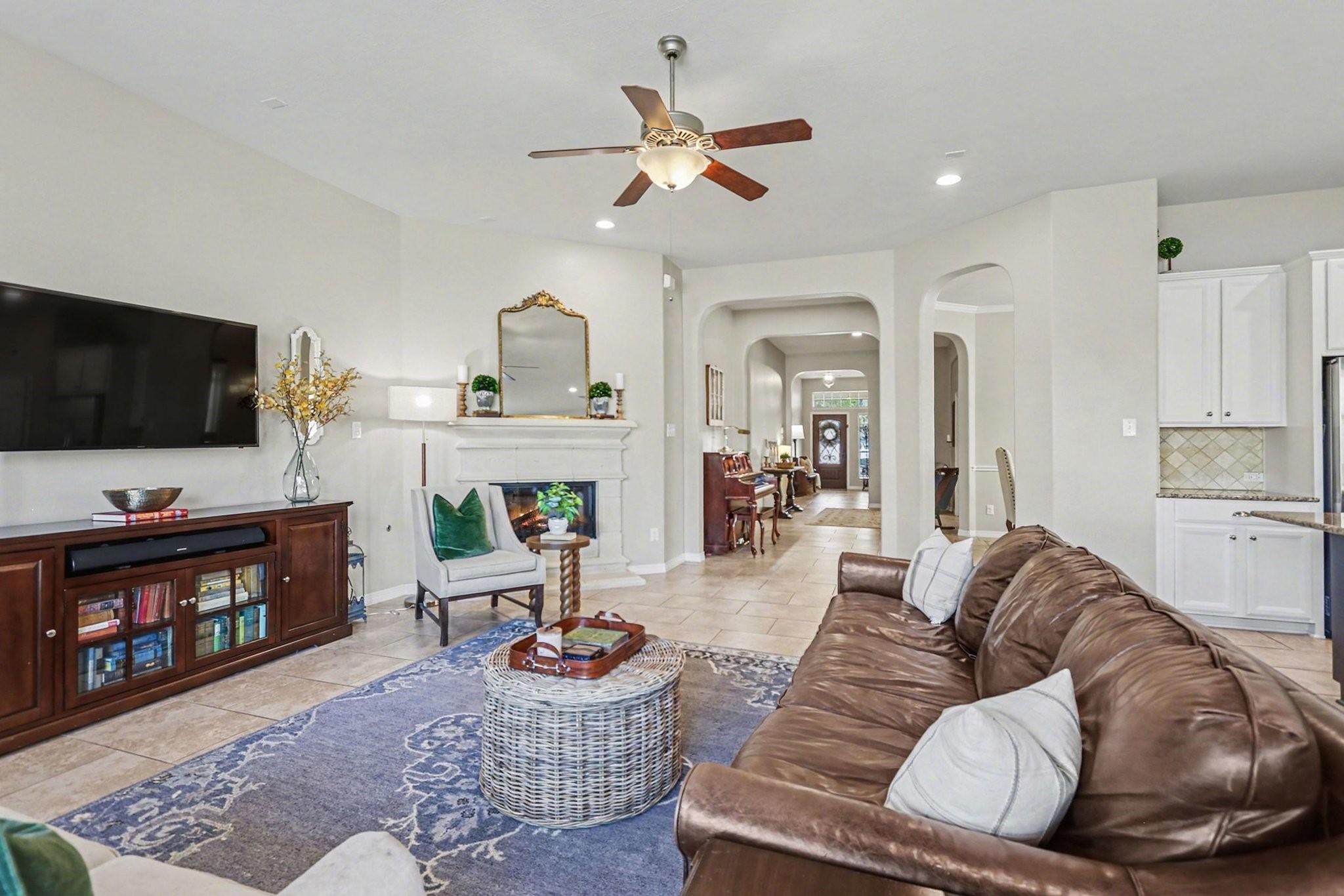27006 Cliff Pointe Lane Katy, TX 77494 - Photo 7 of 34 An open-concept layout connects the living room seamlessly to the kitchen and dining spaces, creating a natural gathering place for family and friends.