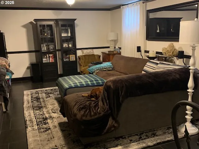 a bedroom with a bed and dresser