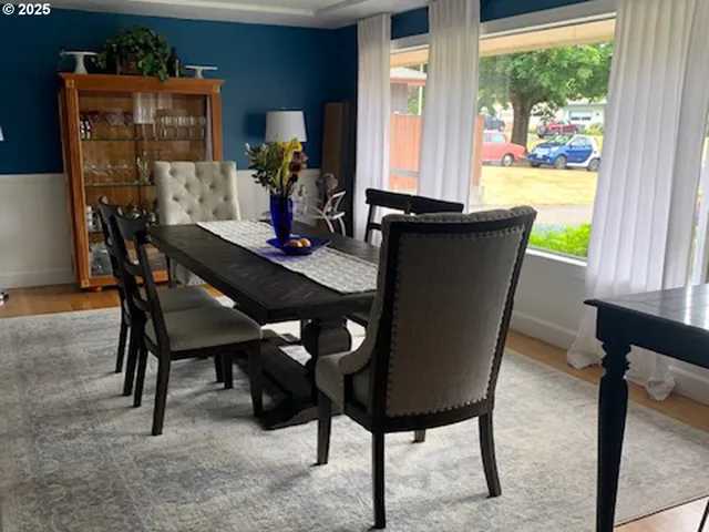 a dining room with furniture and window